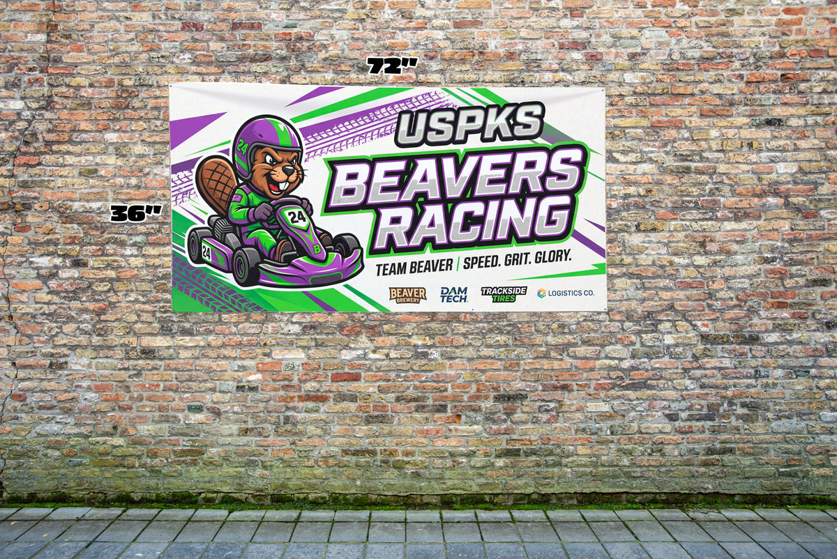 Custom 3x6 vinyl banner for a go-kart racing team, 72 by 36 inches, shown on a brick wall by Beaver Slaps